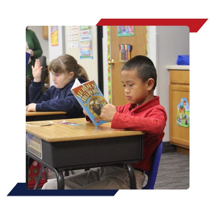 Elementary Student Working at Desk