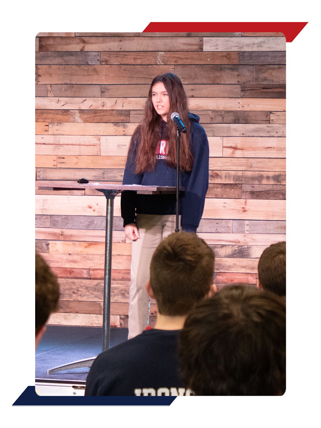 Student speaking in Chapel